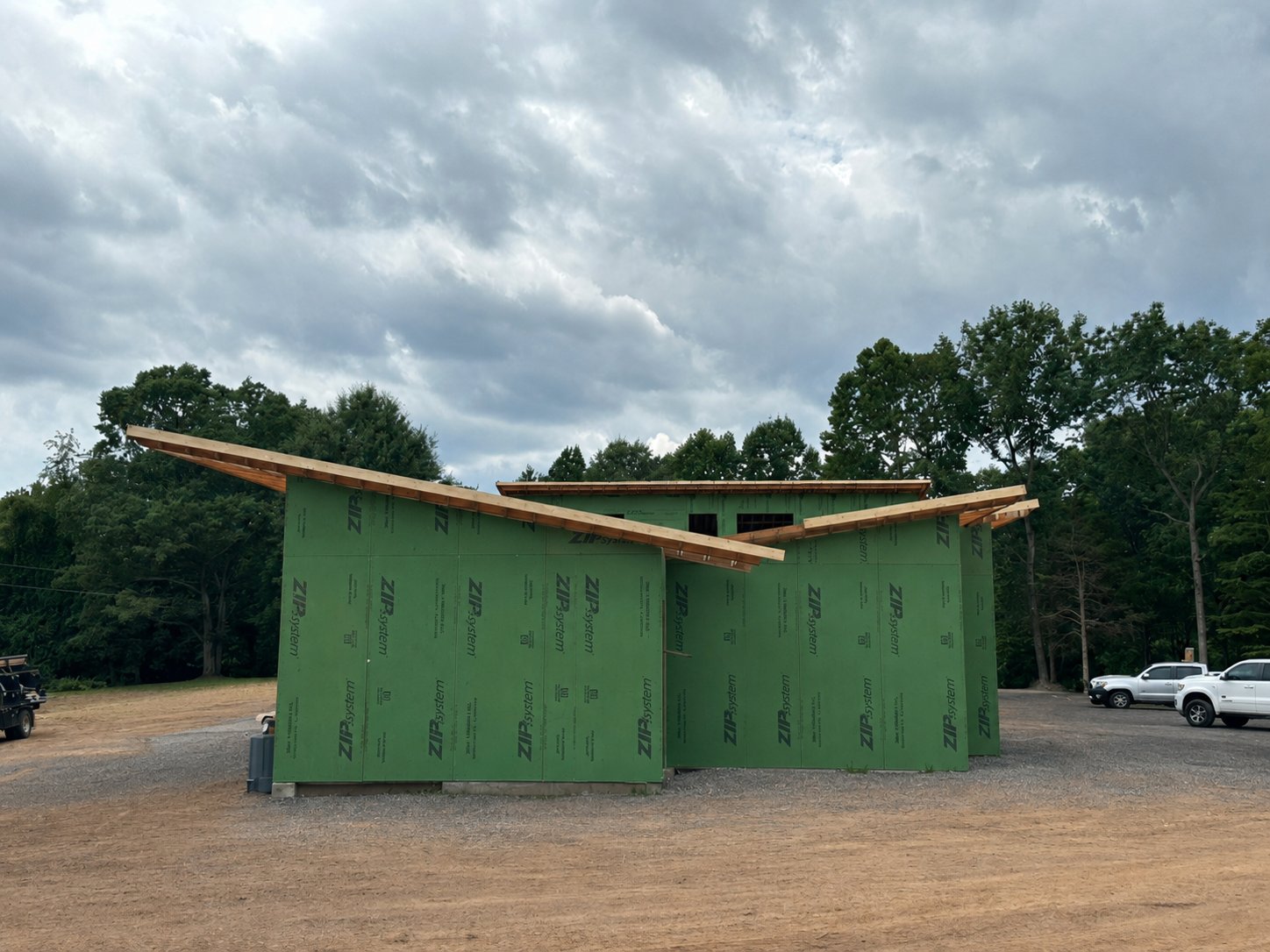 Haymarket sheathed in green ZIP System with a standing-seam metal roof going on