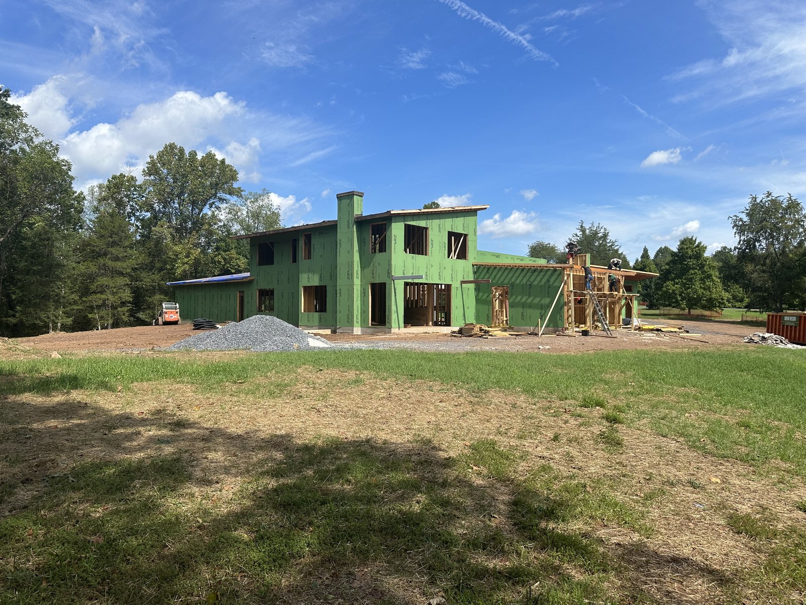 Haymarket garden elevation sheathed in green ZIP System, taped before cladding