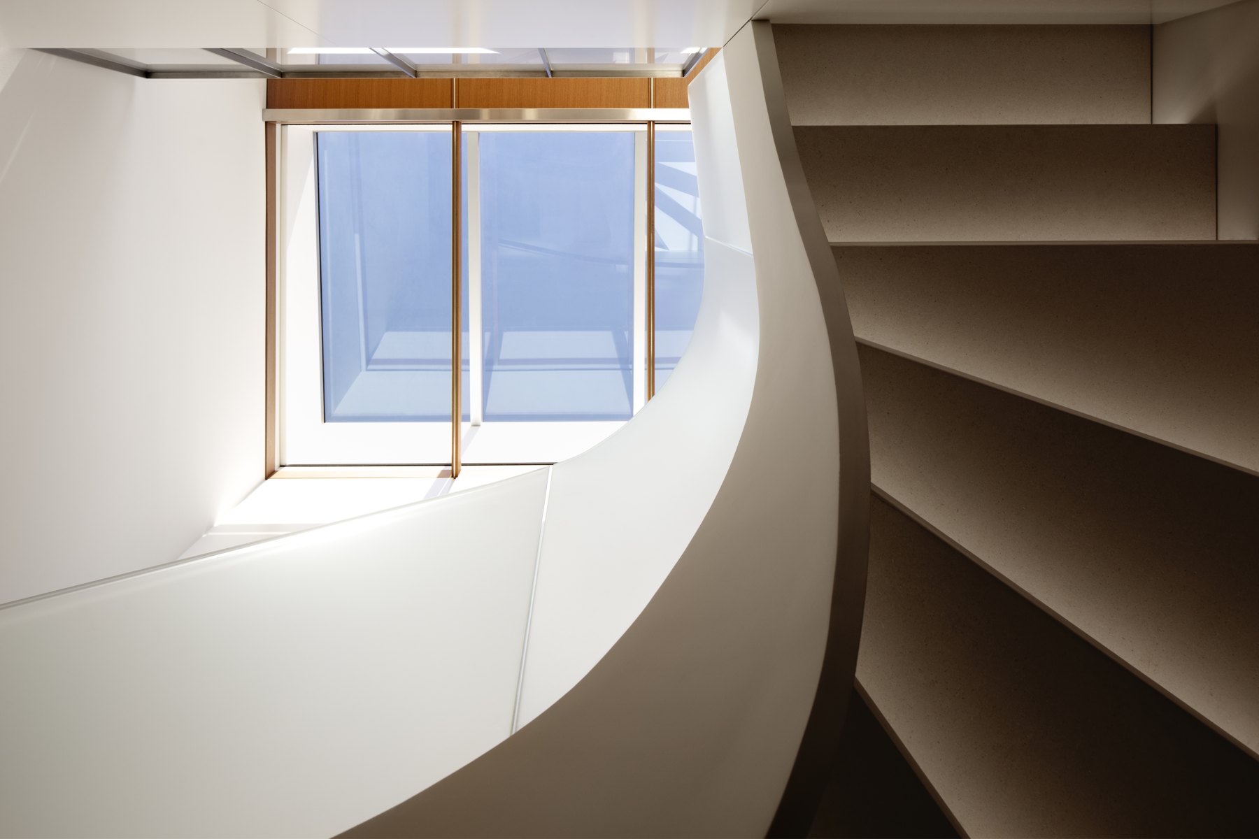 Logan Penthouse — sculptural white stair rising through a bright modern Washington DC home